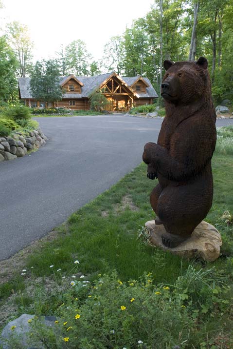 Carved Wooden Bear Outside Cabin