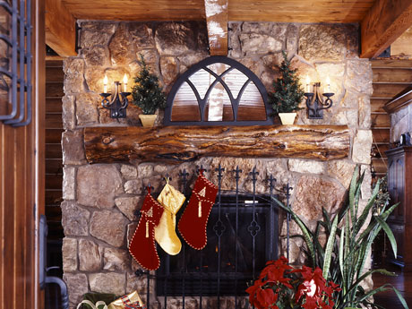 Stockings adorn the stone fireplace