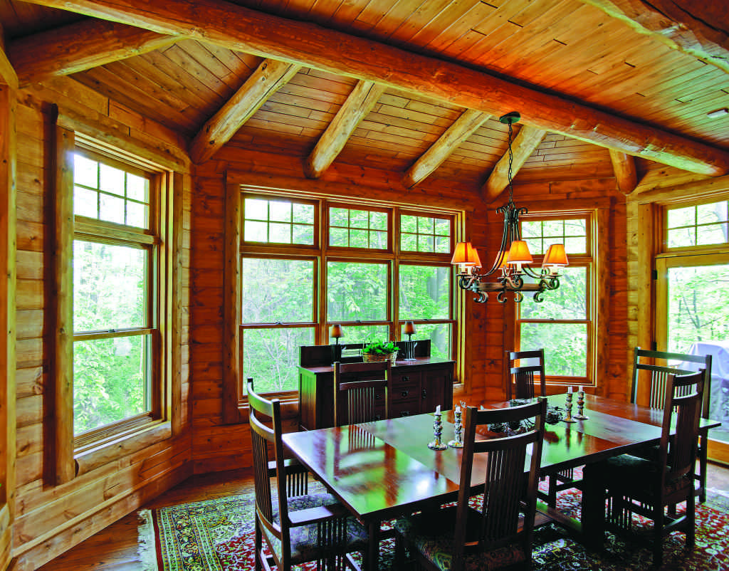 Michigan lakeside log home eating area with windows