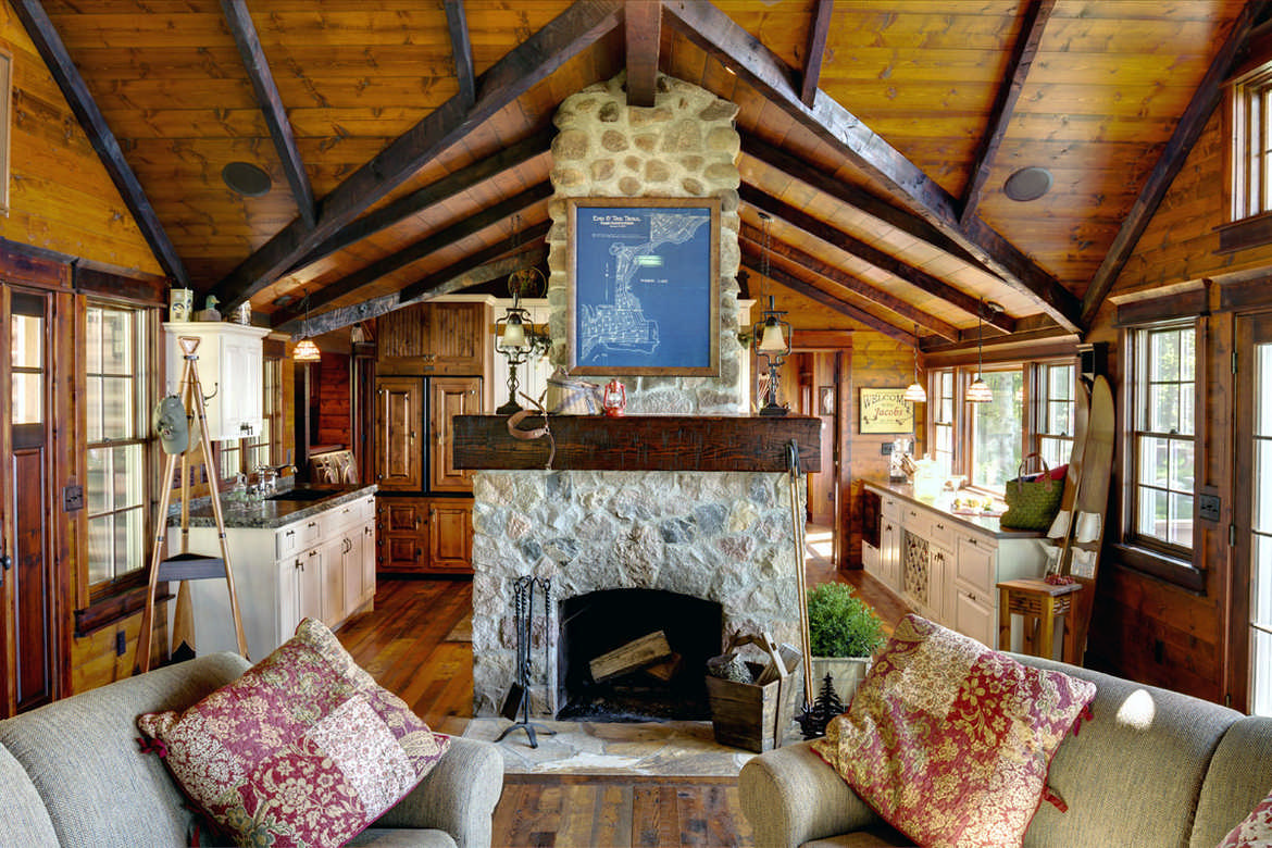 wood beams living room stone fireplace log cabin